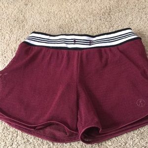 Maroon shorts .